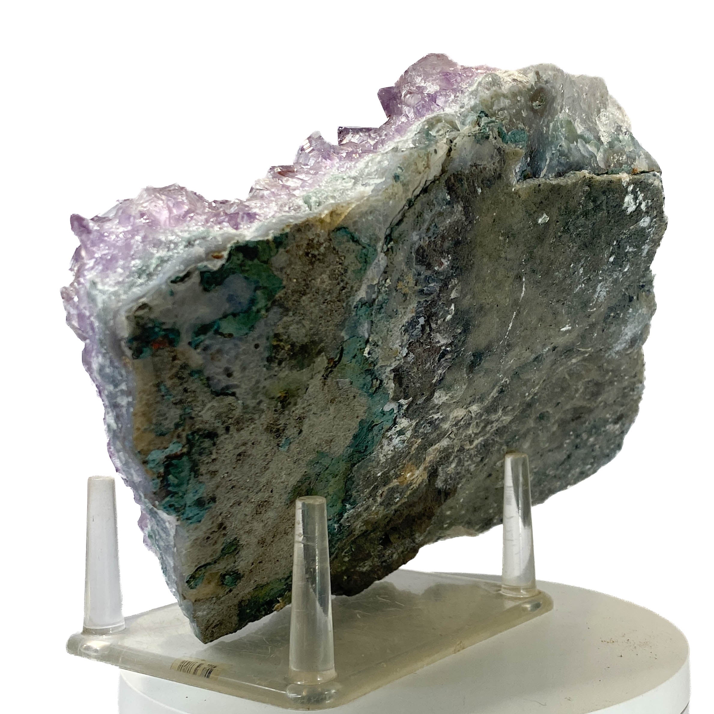 Rich amethyst cluster from South America with cacoxenite inclusions on white background
