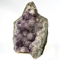Uruguay amethyst geode with stalactite bumps and lavender crystal flowers
