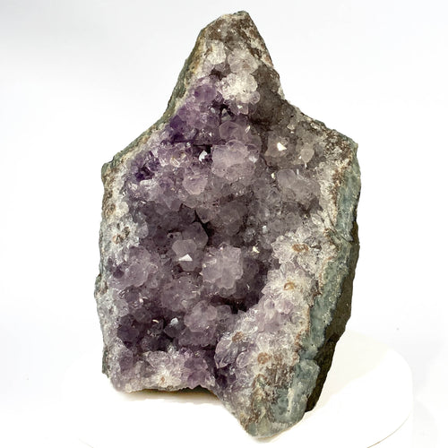 Uruguay amethyst geode with stalactite bumps and lavender crystal flowers