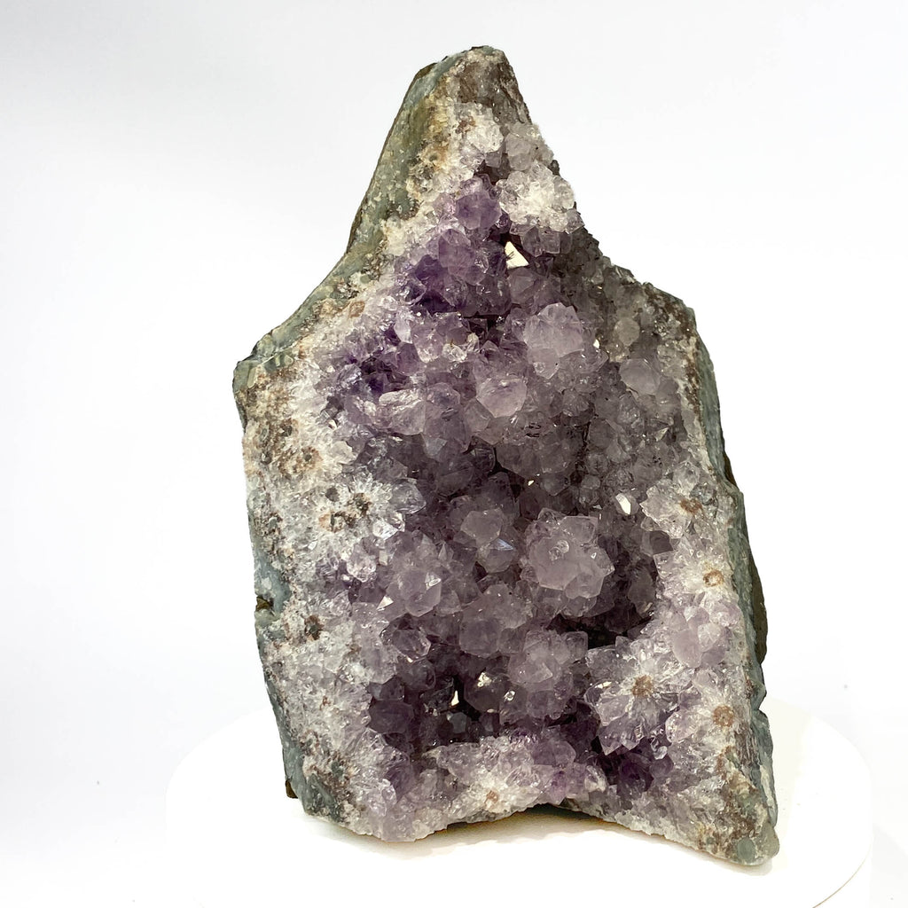 Uruguay amethyst geode with stalactite bumps and lavender crystal flowers