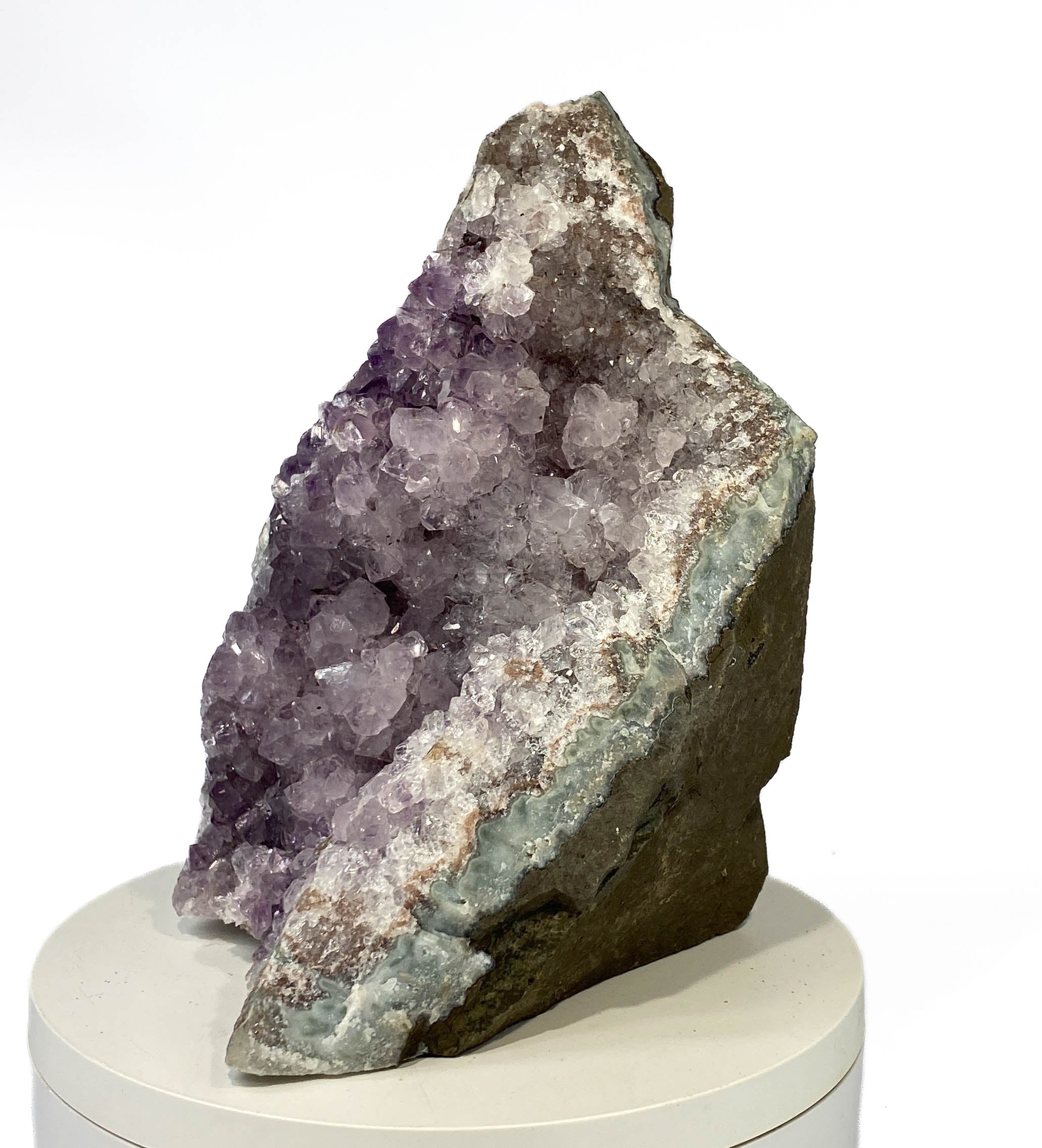 Uruguay amethyst geode with stalactite bumps and lavender crystal flowers