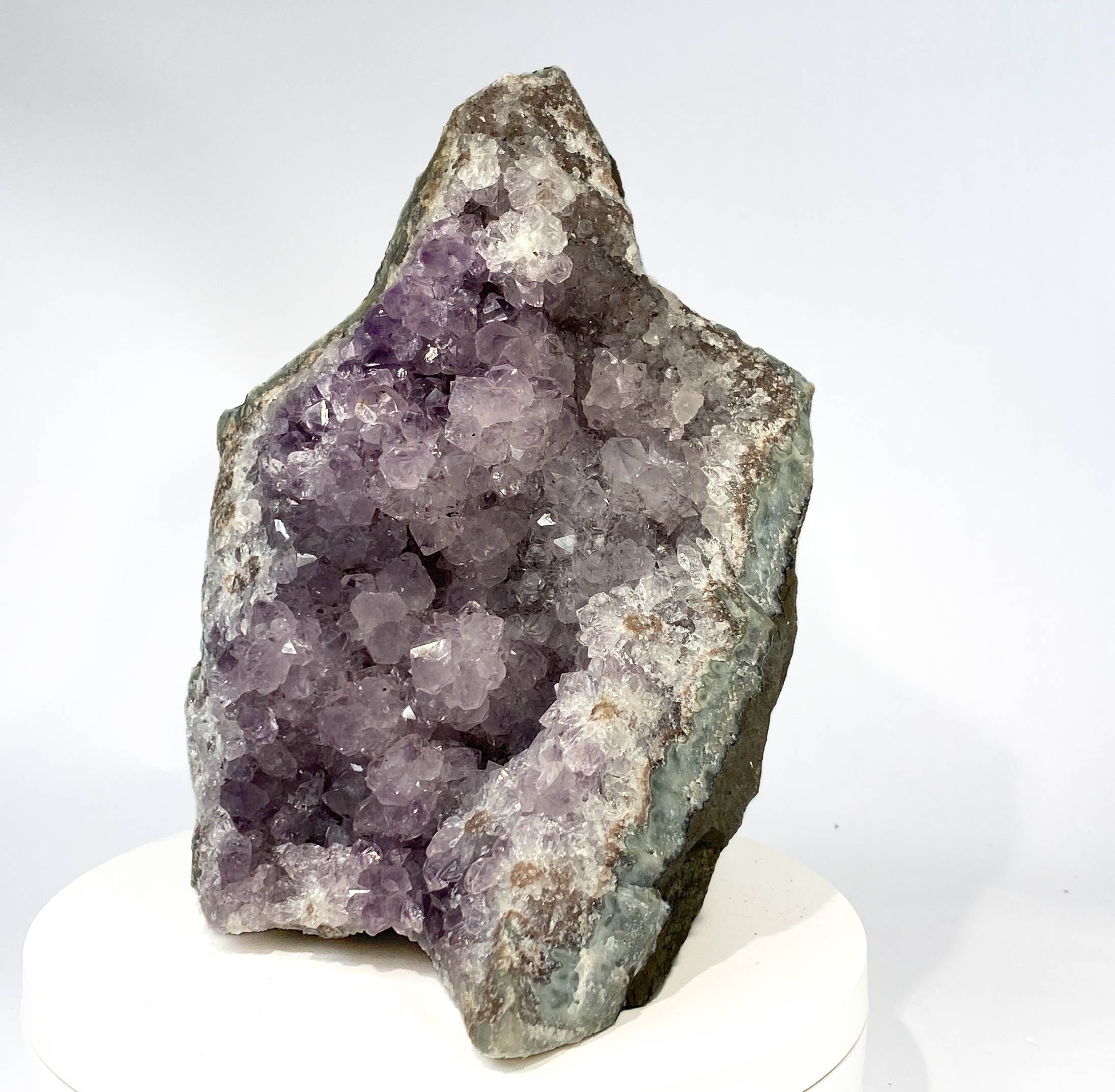 Uruguay amethyst geode with stalactite bumps and lavender crystal flowers