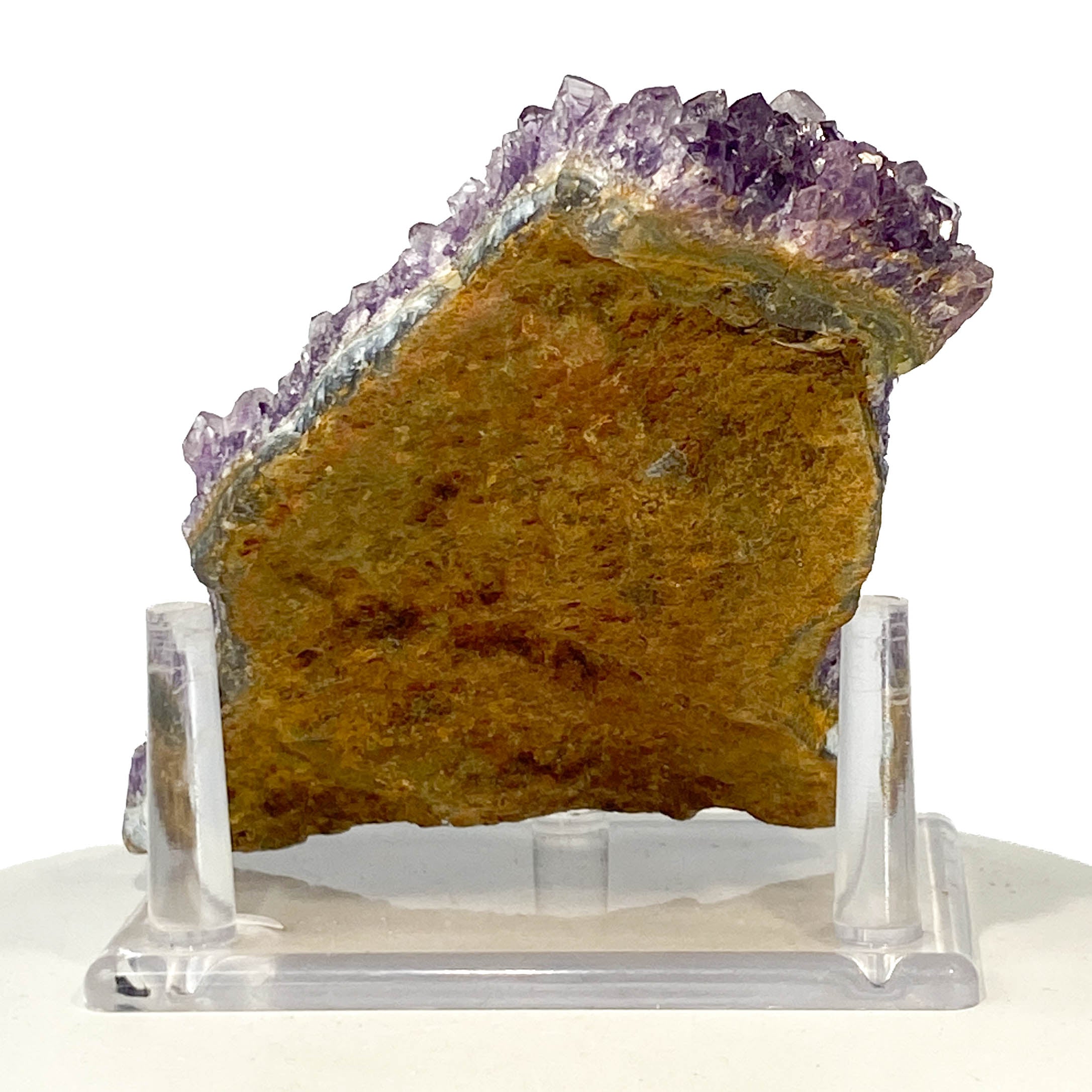 Dark purple amethyst cluster with fine crystal points on white background