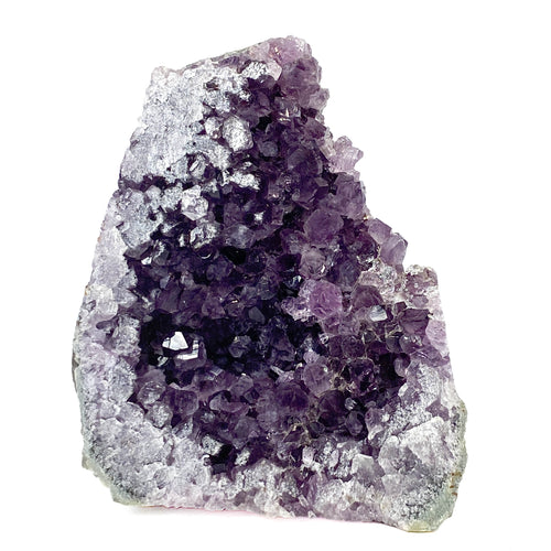 Dark purple amethyst cluster with cross-cut crystal faces on white background