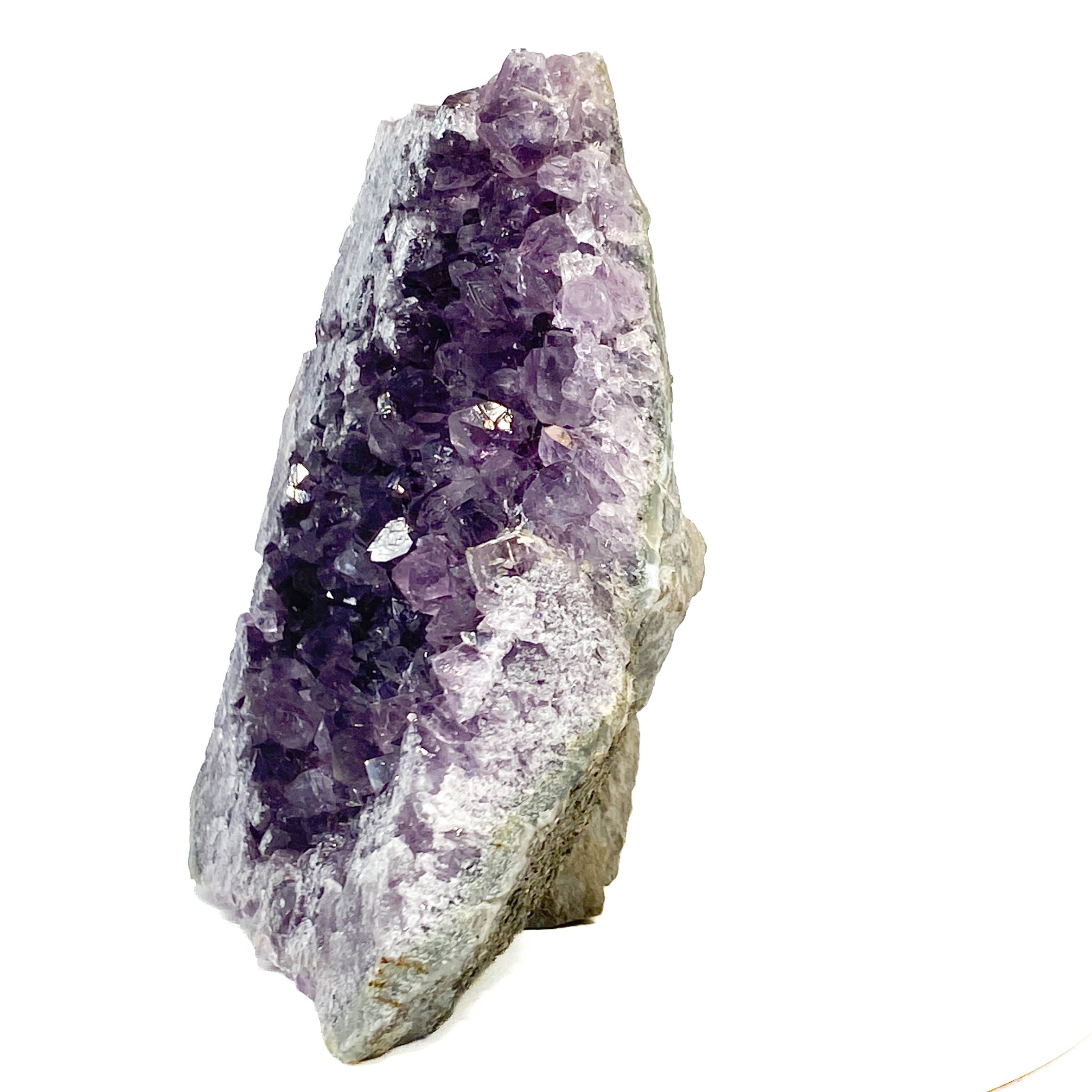 Some crystal faces along one edge have been cross-cut (not naturally terminated) — the cut plane and some resulting crystal damage are visible in the photos, shown clearly for transparency.