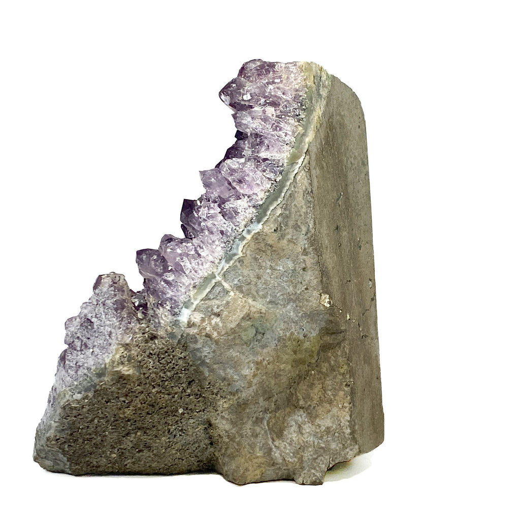 Dark purple amethyst cluster with cross-cut crystal faces on white background