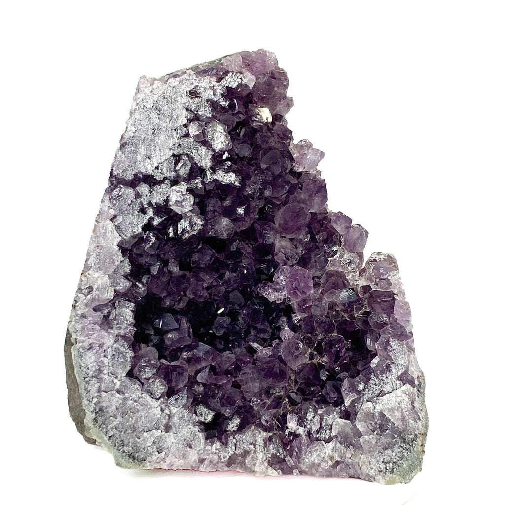 Dark purple amethyst cluster with cross-cut crystal faces on white background
