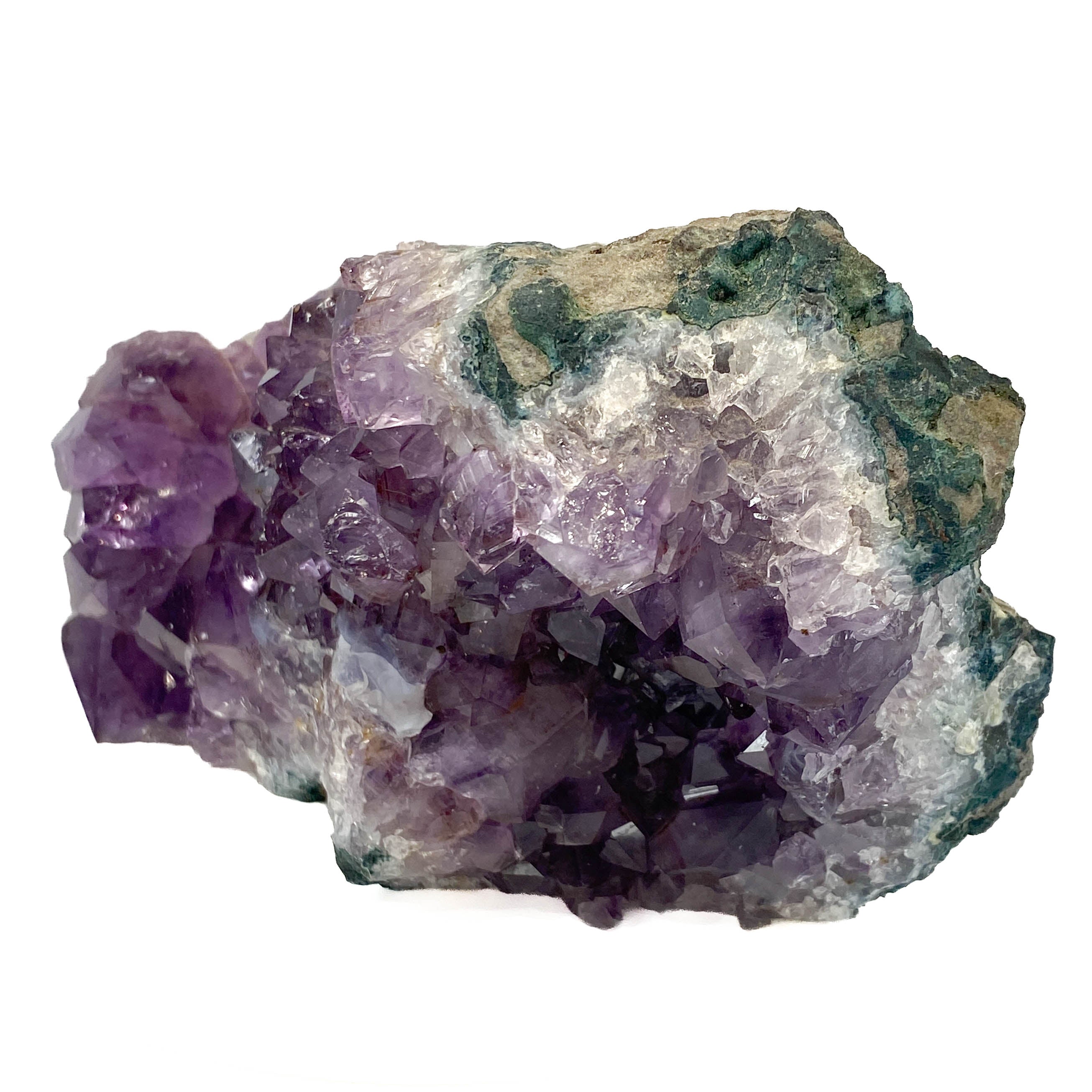 Dark amethyst horizontal standing cluster with small stalactites on white background