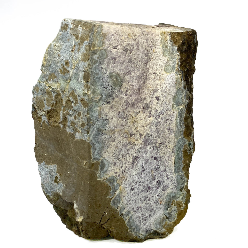 Amethyst geode cross section with clear crystal delineation on white background
