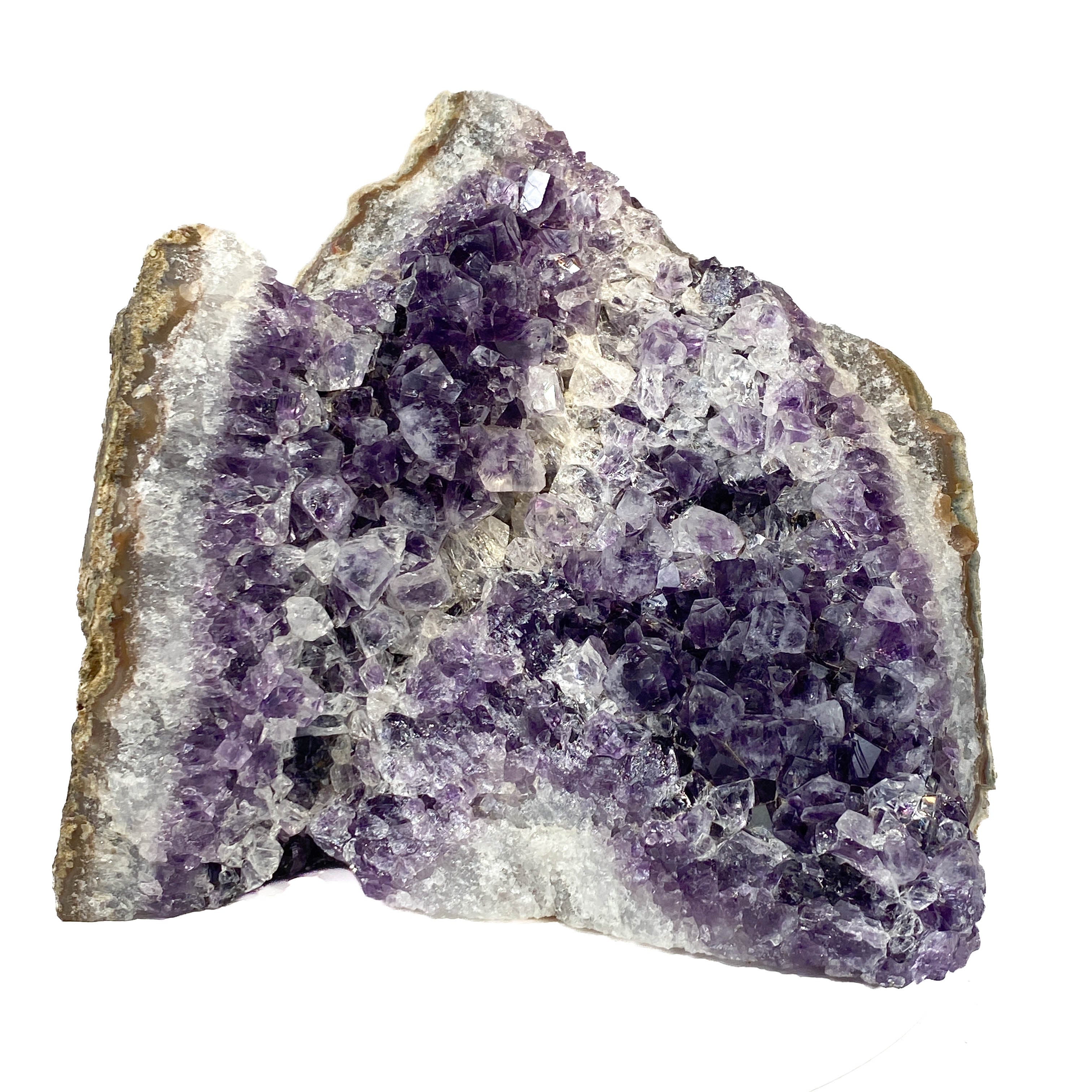 Standing angel-shaped amethyst cluster with dark crystals and phantoms on white background