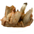 Citrine and golden healer quartz cluster with strong citrine point on white background