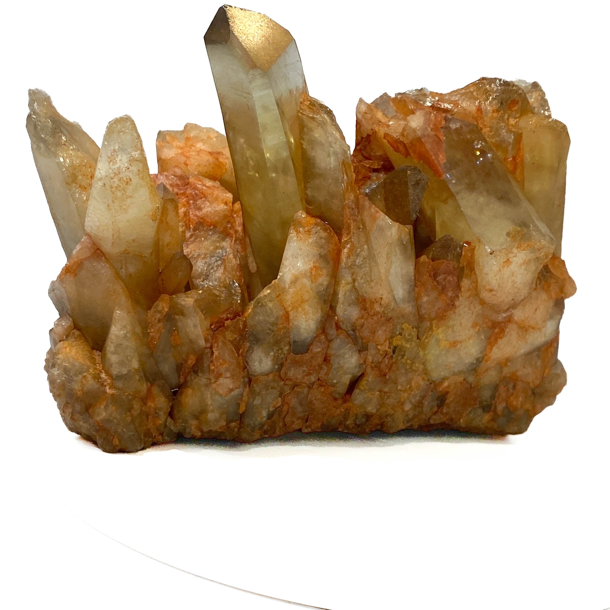 Citrine and golden healer quartz cluster with strong citrine point on white background