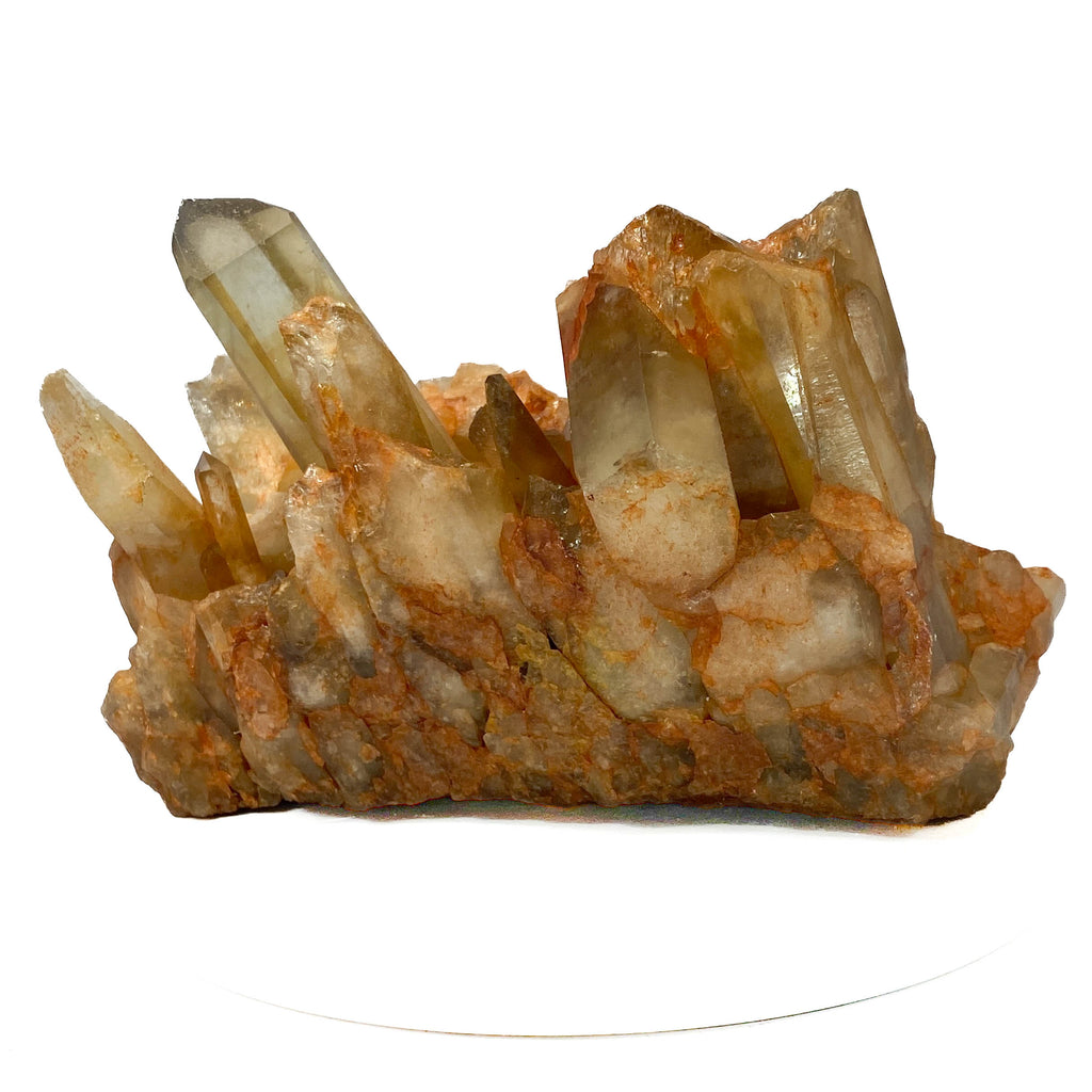 Citrine and golden healer quartz cluster with strong citrine point on white background