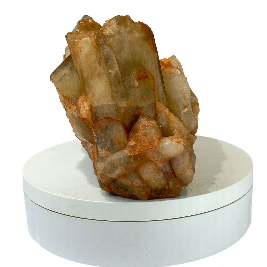Citrine and golden healer quartz cluster with strong citrine point on white background