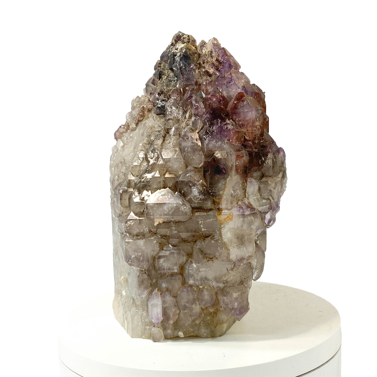 Montana amethyst standing crystal with jacaré elestial formation on white background