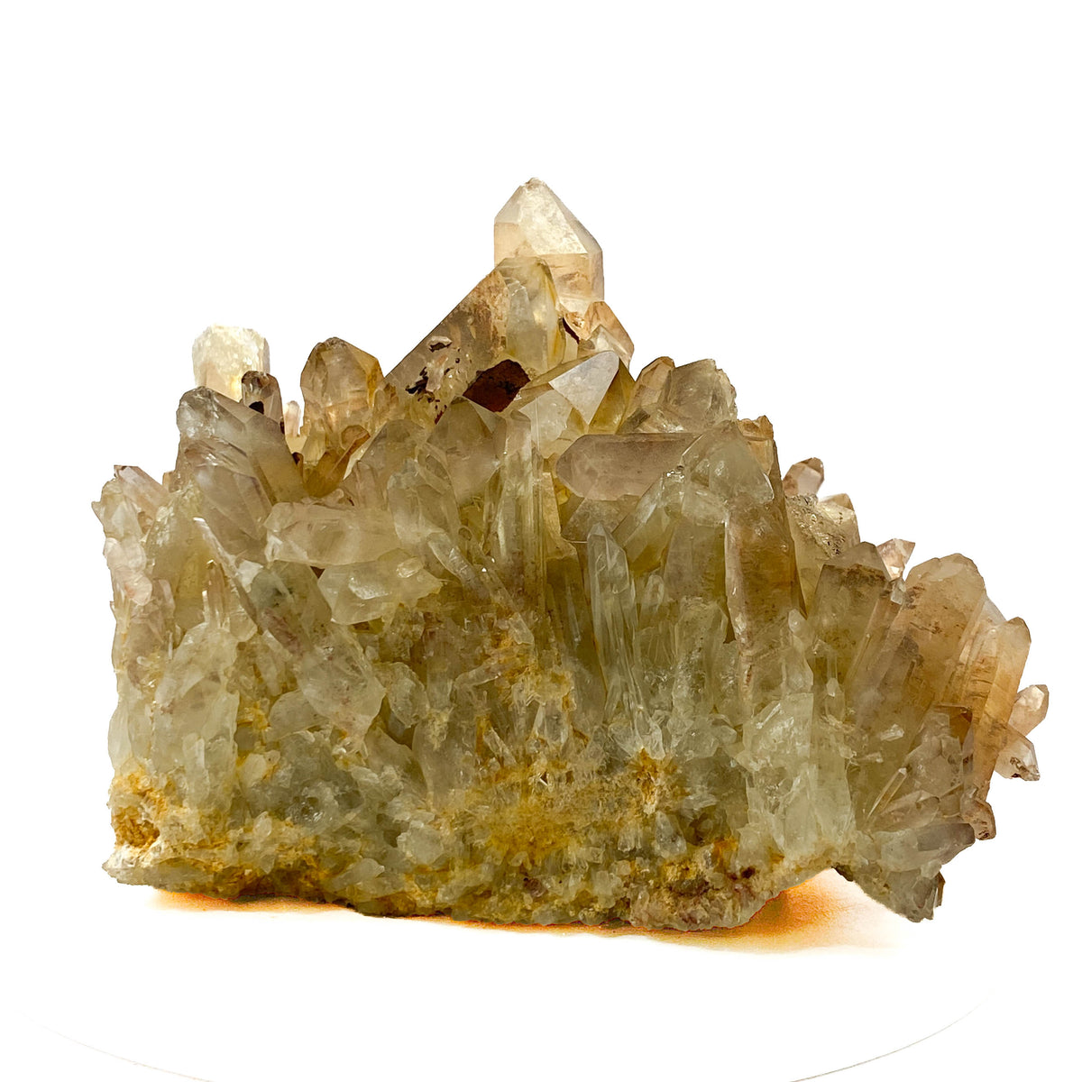 Smoky citrine quartz cluster with many crystal points on white background
