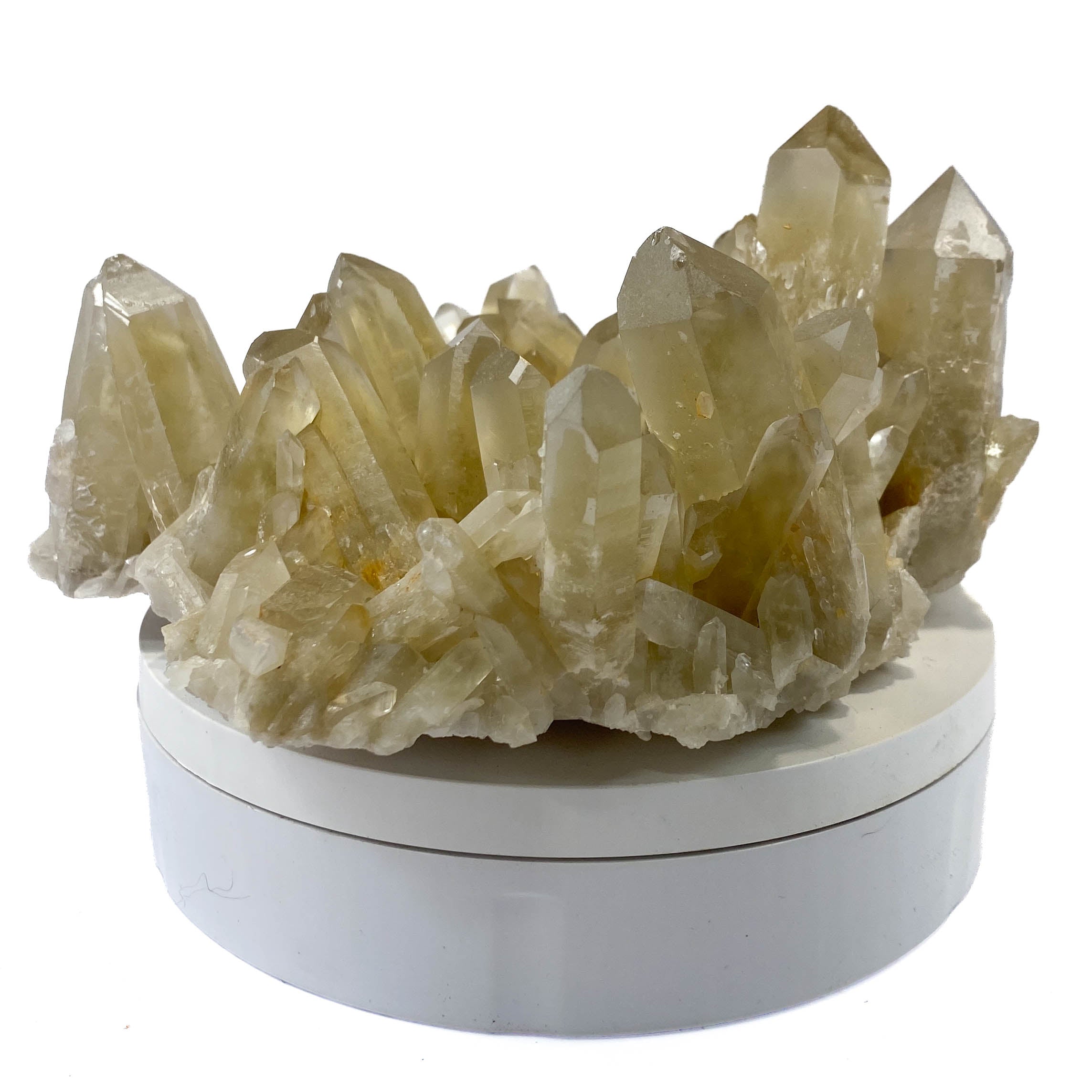 Natural citrine quartz cluster with clear crystal points on white background