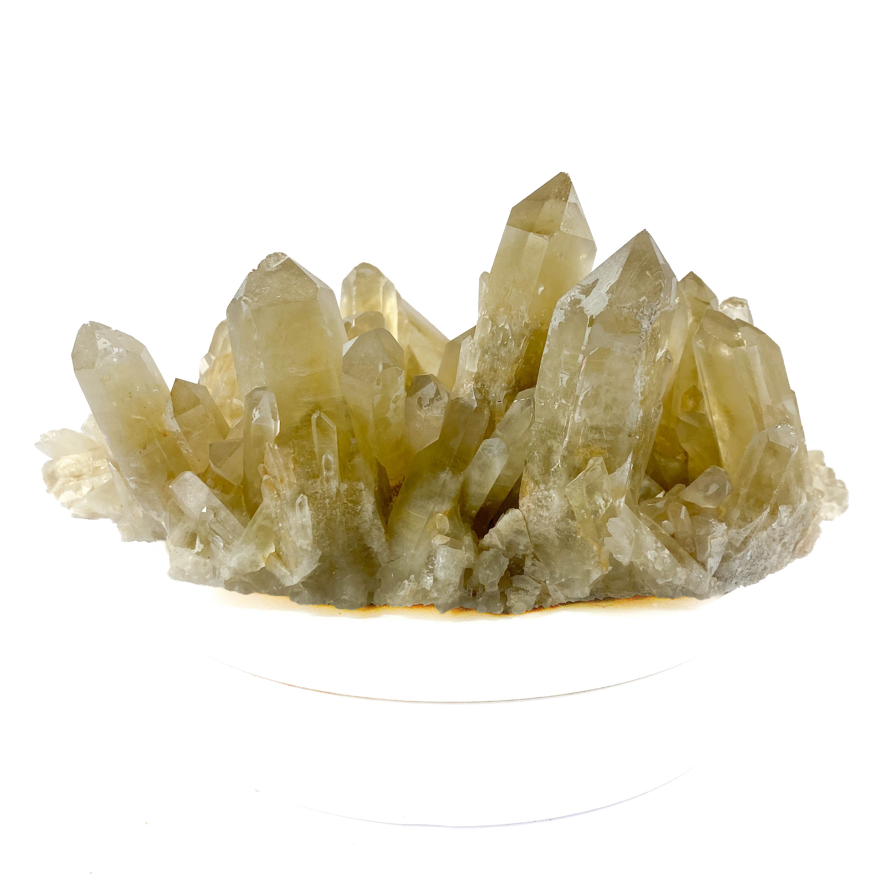 Natural citrine quartz cluster with clear crystal points on white background