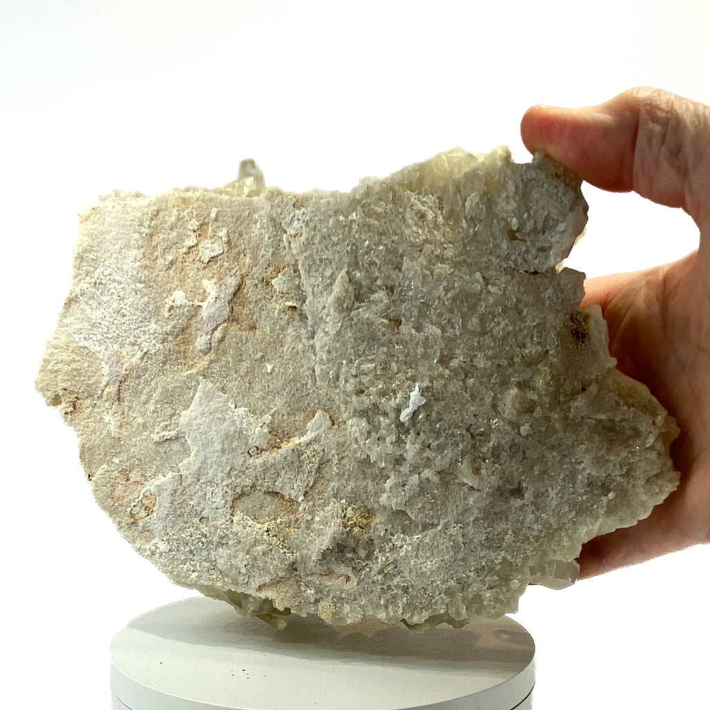 Natural citrine quartz cluster with clear crystal points on white background