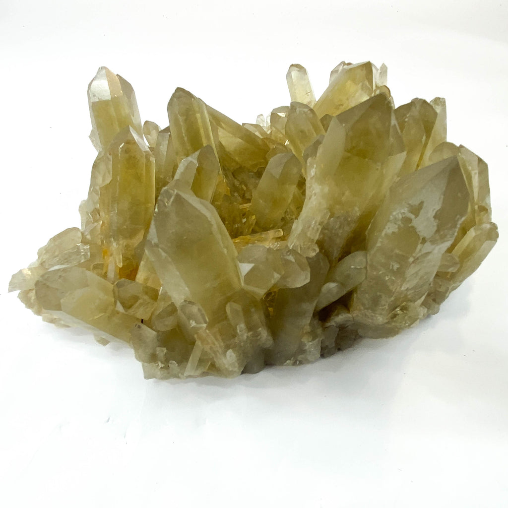 Natural citrine quartz cluster with clear crystal points on white background