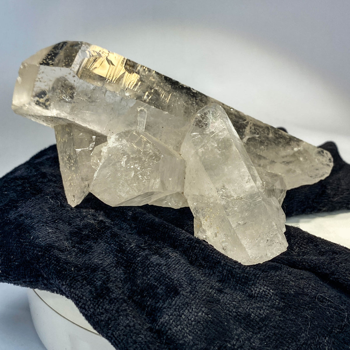 Waterclear quartz crystalline aggregate cluster on white background