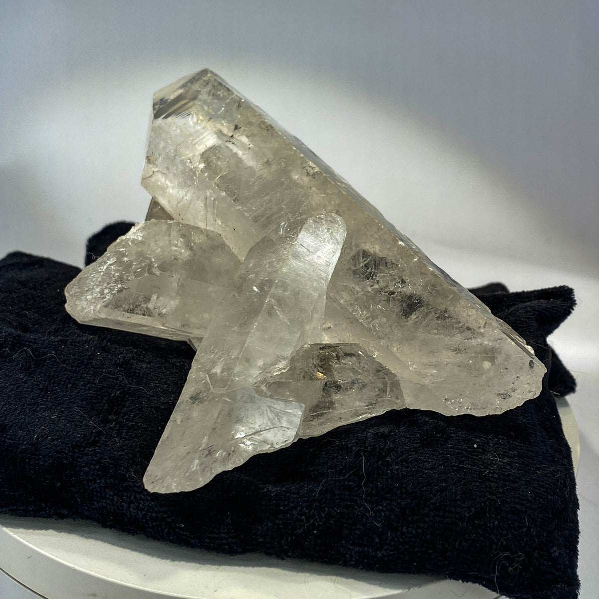 Waterclear quartz crystalline aggregate cluster on white background