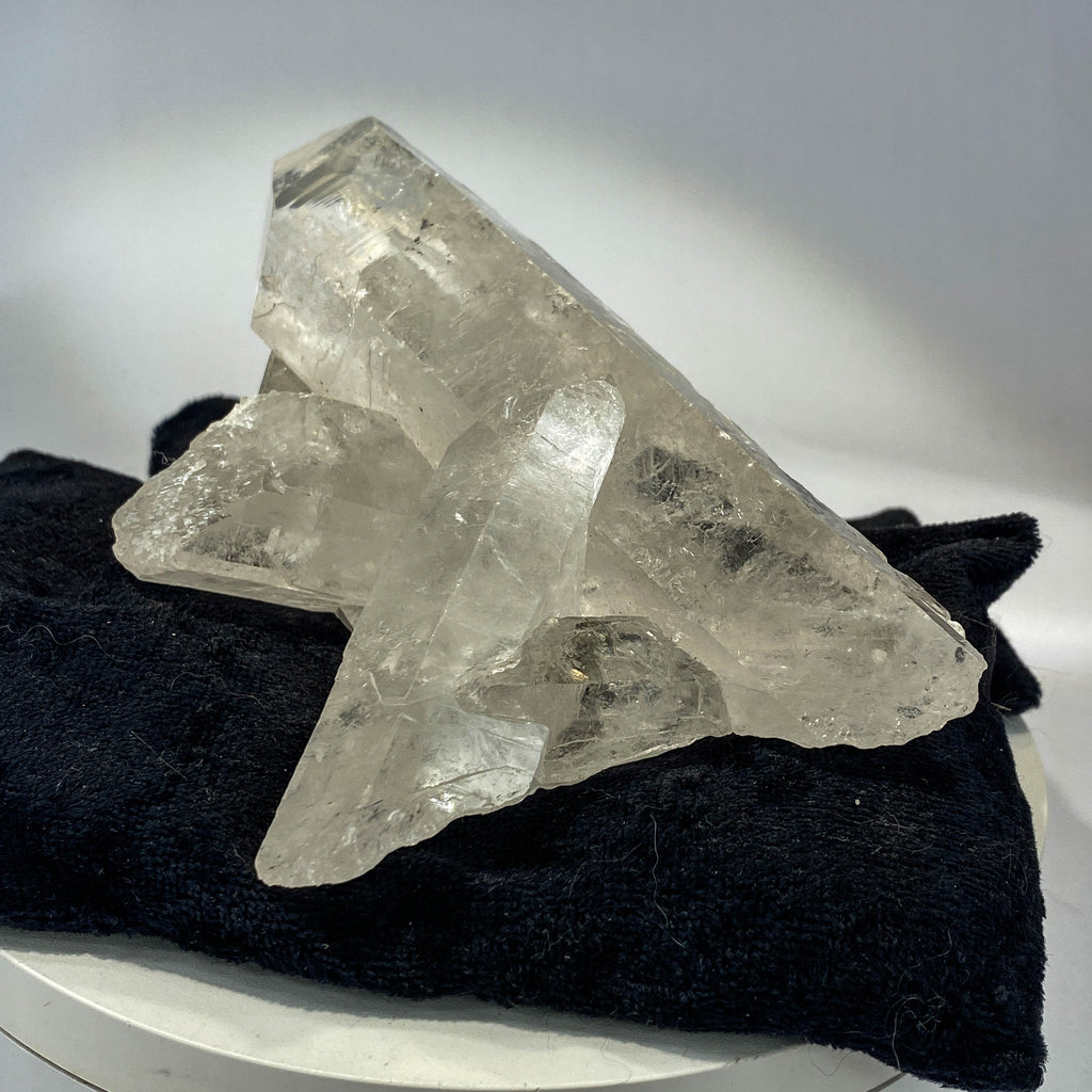 Waterclear quartz crystalline aggregate cluster on white background