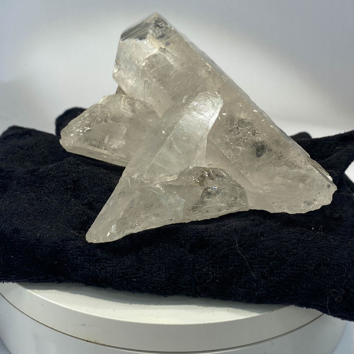 Waterclear quartz crystalline aggregate cluster on white background