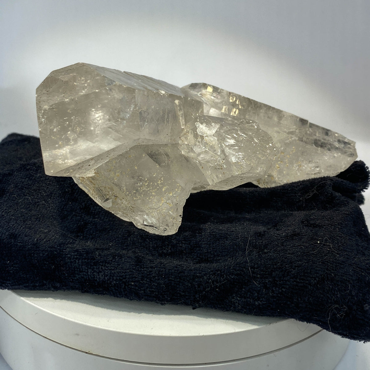Waterclear quartz crystalline aggregate cluster on white background