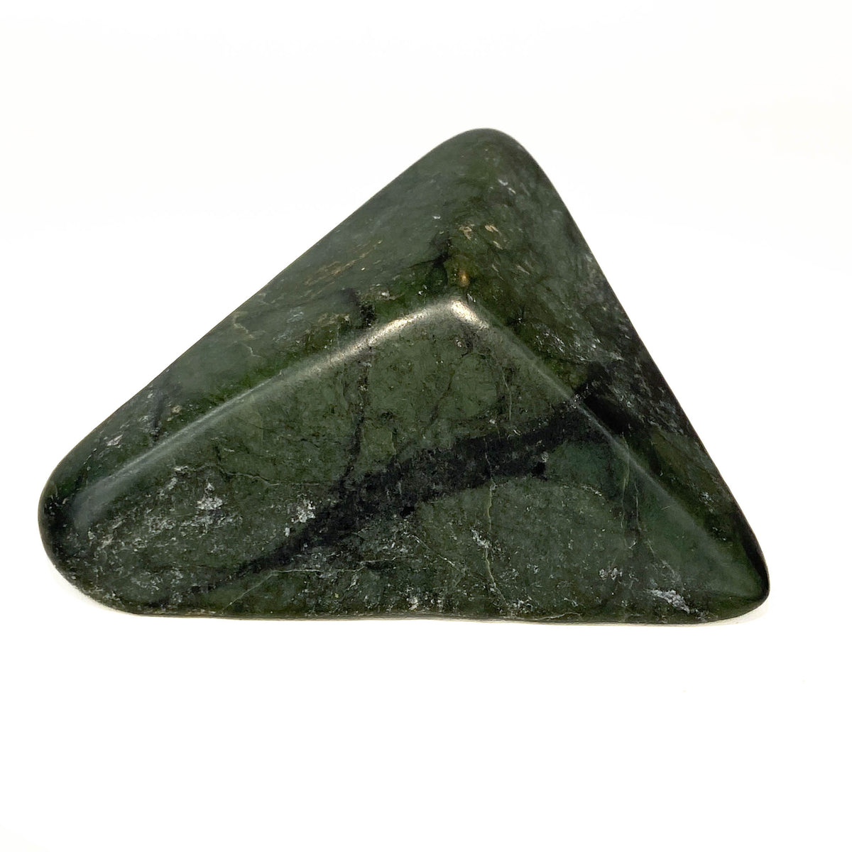 Carved Washington jade triangle with tree pattern on white background