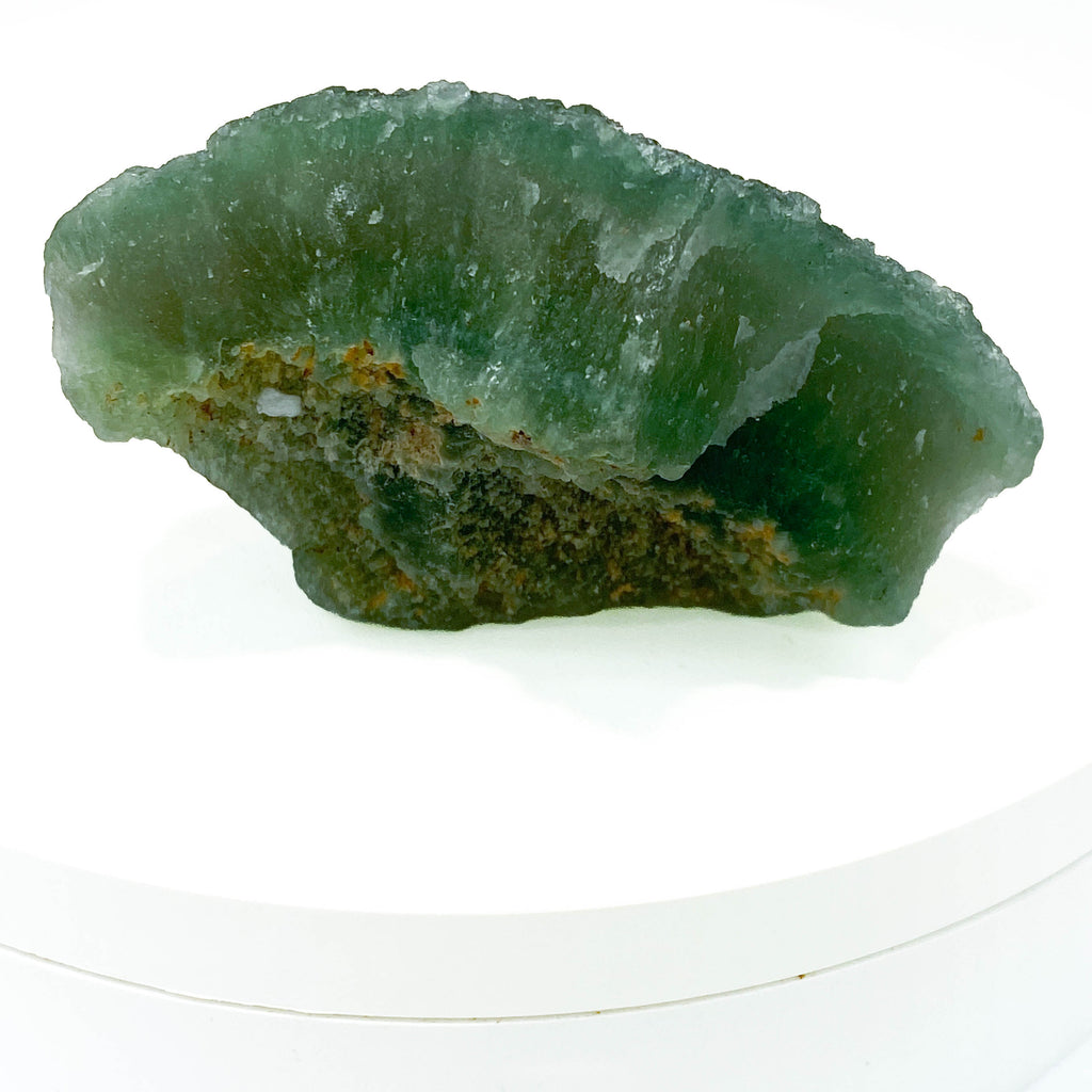 Botryoidal green fluorite specimen on white background