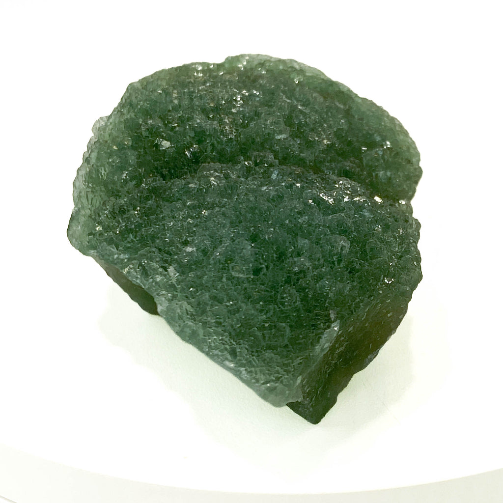 Botryoidal green fluorite specimen on white background