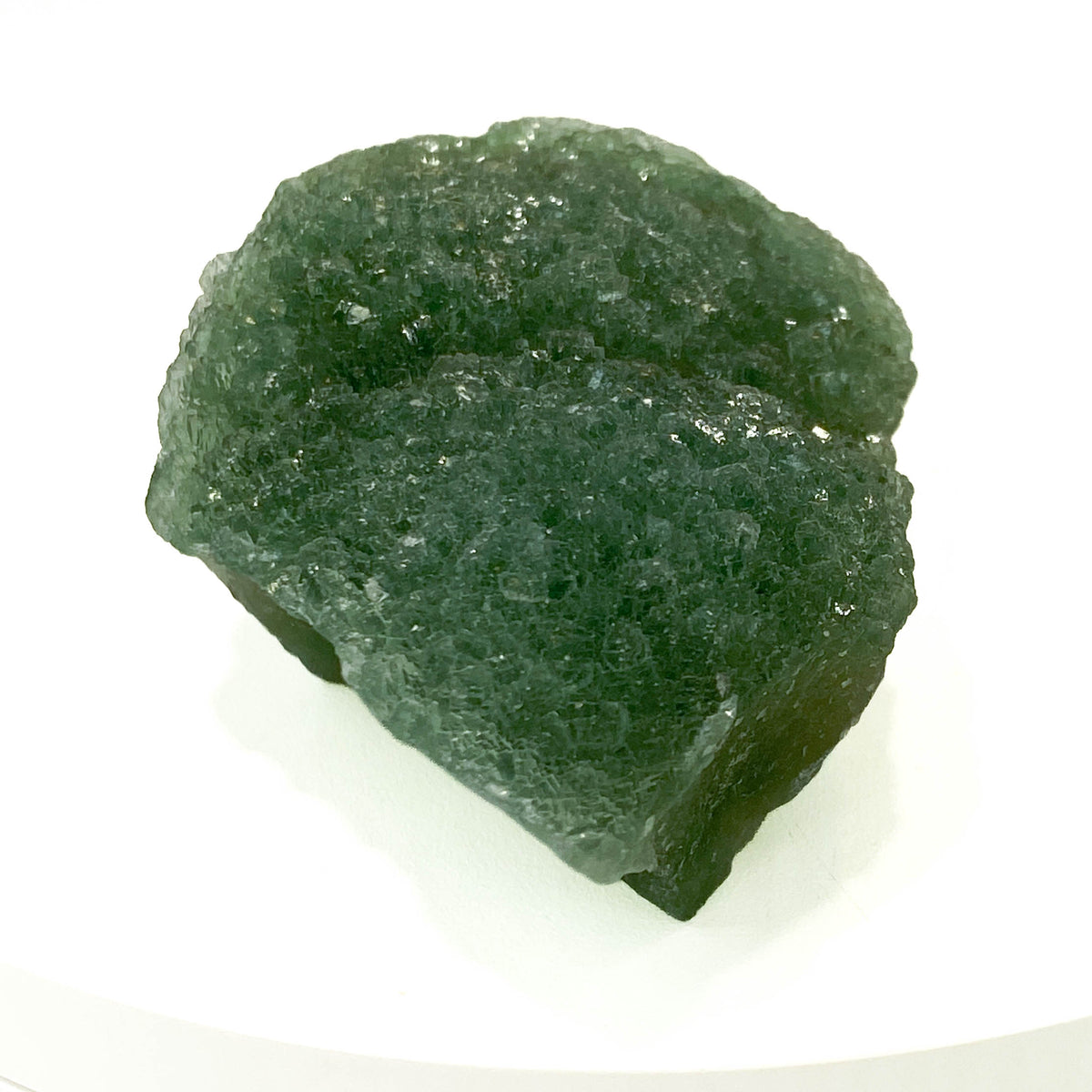 Botryoidal green fluorite specimen on white background