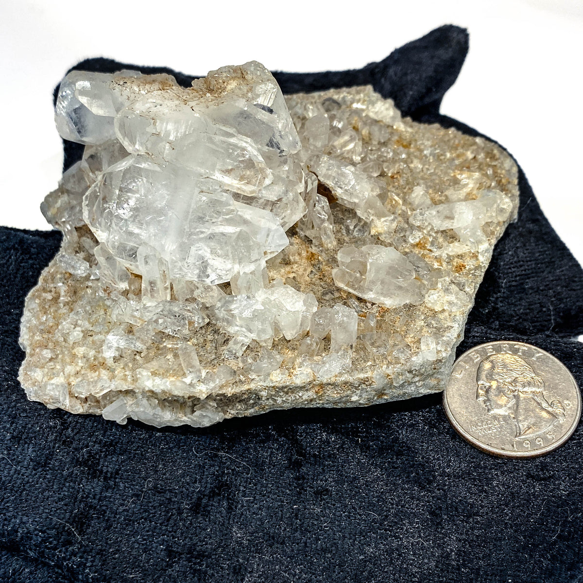 Double-sided quartz plate with clear crystal cluster on dark cloth background