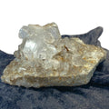 Double-sided quartz plate with clear crystal cluster on dark cloth background